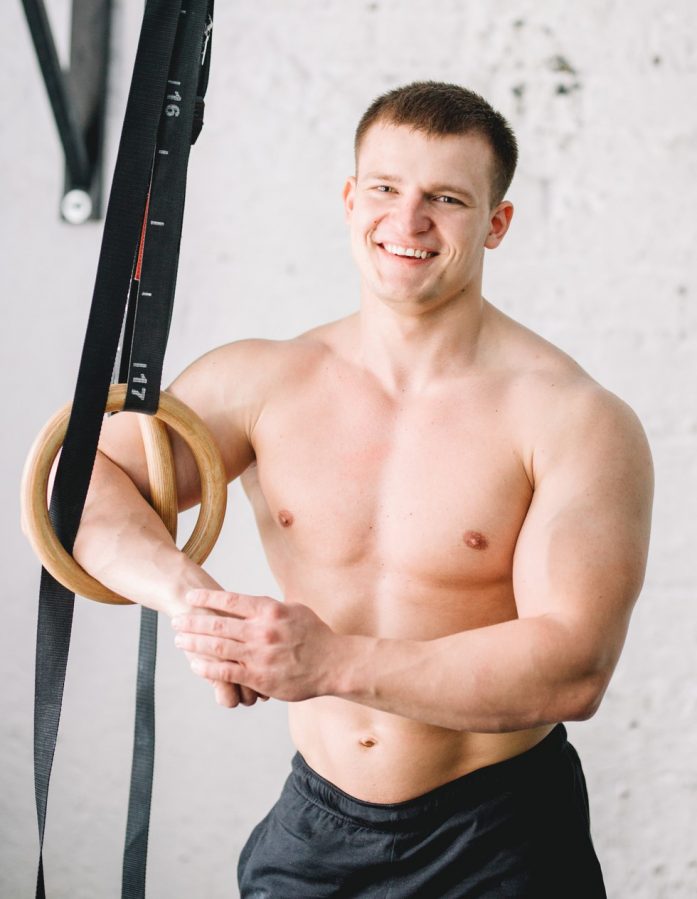 Portrait of a handsome male bodybuilder sitting in fitness gym - Best 5